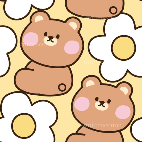 a brown teddy bear sitting next to a flower