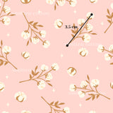 a repeating pattern of white and brown flowers on branches against a pink background.