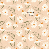 a repeating pattern of white daisies with green leaves against a peach background.