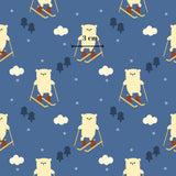 a repeating pattern of cartoon-style polar bears skiing on a blue background, with clouds and trees scattered throughout the scene.