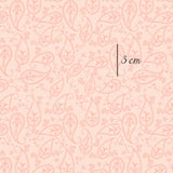 a pink background with a paisley pattern