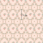 a pink wallpaper with a floral design on it