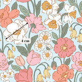 The image is a repeating pattern of various colorful flowers, including roses, daisies, and other blooms, against a light blue background.