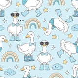 a repeating pattern of cartoon-style ducks wearing sunglasses and rain boots, along with various other whimsical elements such as rainbows, clouds, and stars. The image is approximately 6 centimeters in size.