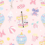 a pink wallpaper with a carousel and balloons