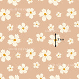 a repeating pattern of white flowers against a peach background.