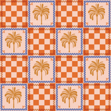 an orange and blue checkered pattern with a palm tree