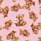 a repeating pattern of brown teddy bears against a pink background.