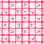 a repeating pattern of pink and white checkered squares with pink flowers and green leaves.