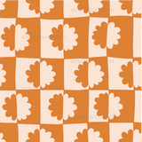 an orange and white checkered pattern with leaves