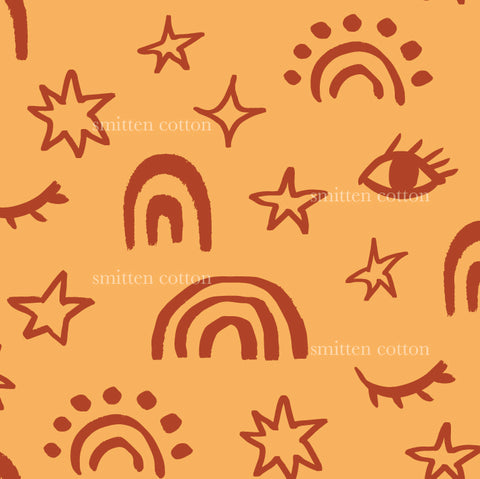 an orange background with stars and a rainbow