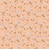 a repeating pattern of small white flowers with green leaves against a peach-colored background.