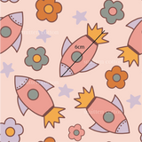 a pattern with a rocket and flowers on a pink background