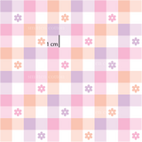 a pink and purple checkered pattern with flowers