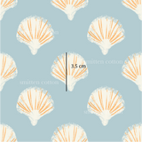 a blue background with orange and white seashells