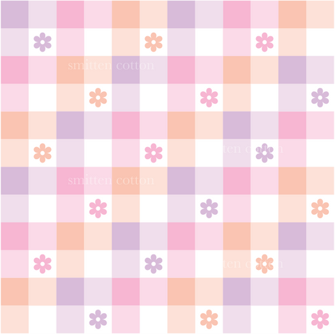 a pink and purple checkered pattern with flowers