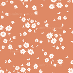 a pattern of white flowers on an orange background