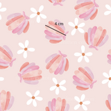 a pink and white flower pattern on a pink background